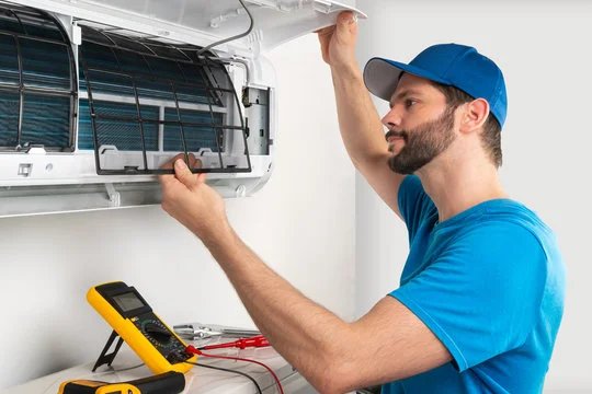 Technician carrying out an appliance repair